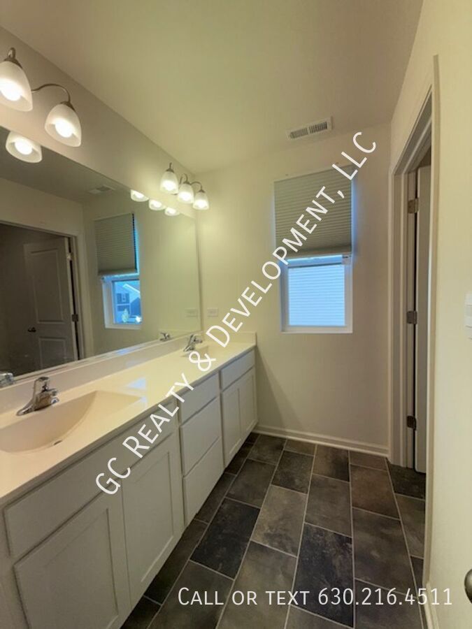 *** NEWER CONSTRUCTION / 4 BDRM - 2.5 BTH / FENCED YARD / IN UNIT LAUNDRY / SOLAR PANELS & TESLA CHARGER *** property image